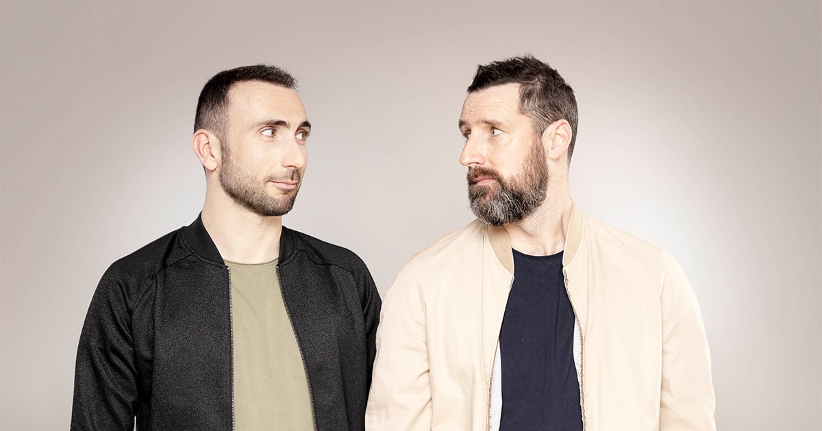 La Bajon et Vincent Leroy côte à côte, échangeant un regard complice.